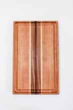 Load image into Gallery viewer, Cutting board made with cherry wood and strips of purpleheart, walnut and maple wood. This board features a juice groove.
