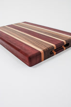 Load image into Gallery viewer, Handmade cutting board with strips of purpleheart, walnut and maple wood. 
