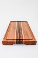 Load image into Gallery viewer, Cutting board made with cherry wood and strips of purpleheart, walnut and maple wood. This board features a juice groove.
