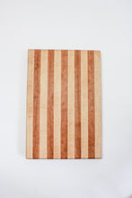 Load image into Gallery viewer, Handmade cutting board with alternating strips of cherry and hard maple wood.
